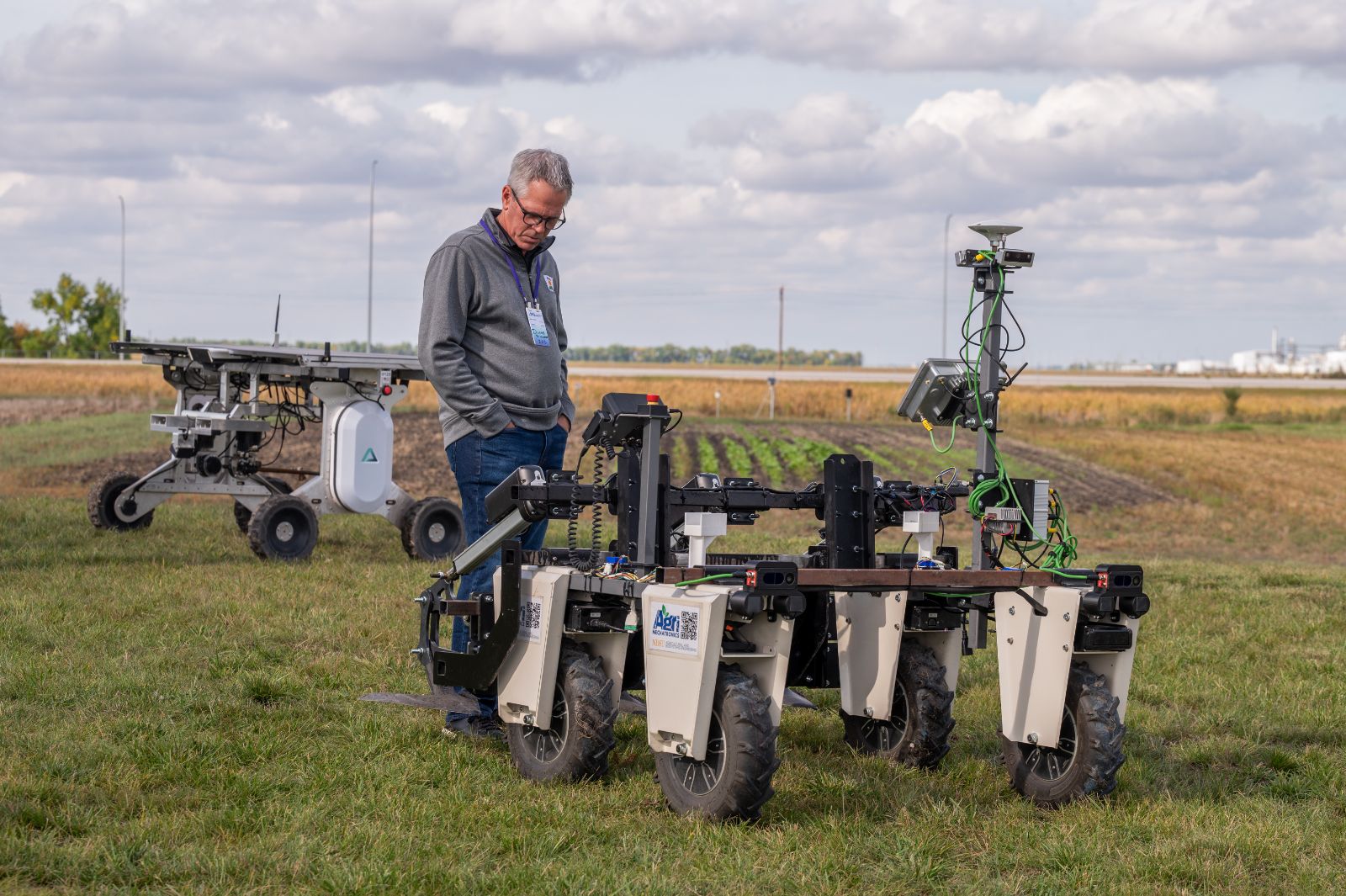 Visitor inspecting the weeding robot