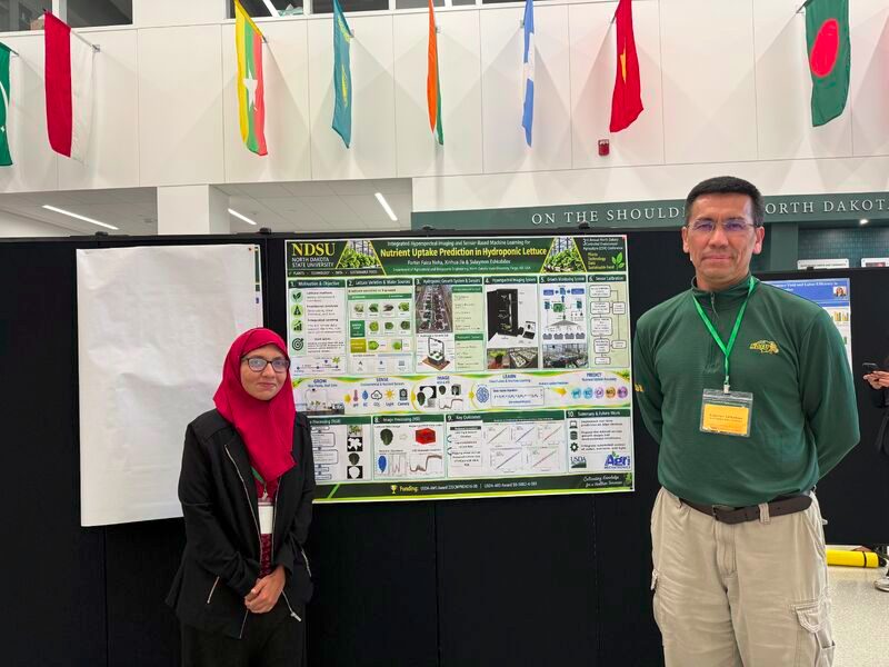 Farhin Faiza Neha with Dr. Eshkabilov at her poster