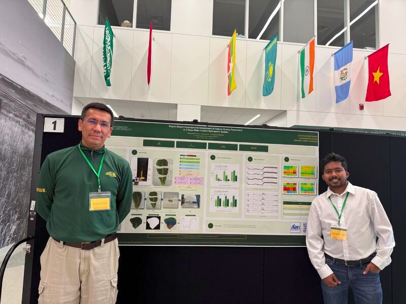 Mahmud Alam Pranto with Dr. Eshkabilov at his poster