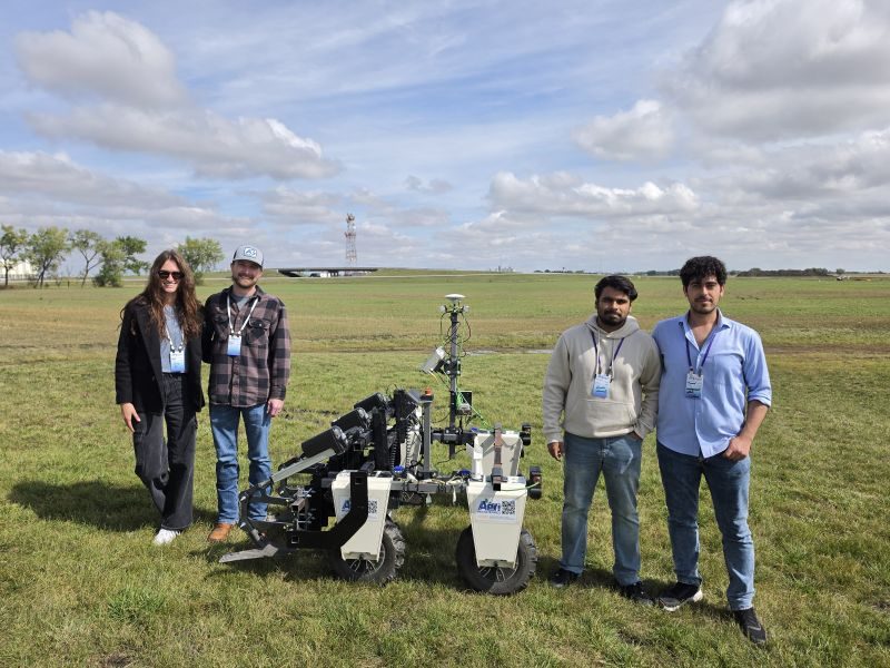 The site-specific weeding robot with the team in the field