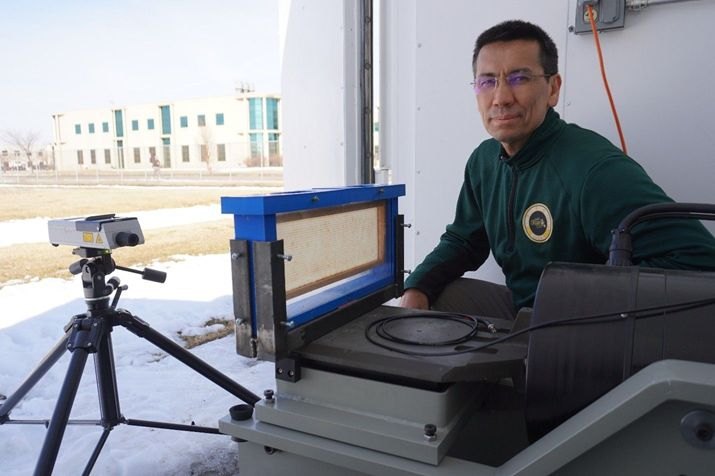 Dr. Eshkabilov with the laser vibrometer test rig
